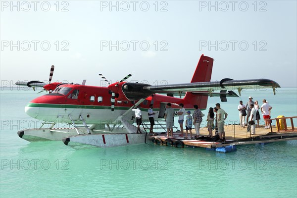 Passengers boarding a De Havilland Canada DHC-6 Twin Otter hydroplane