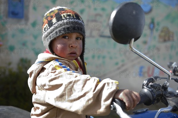 Small boy on a motorcycle