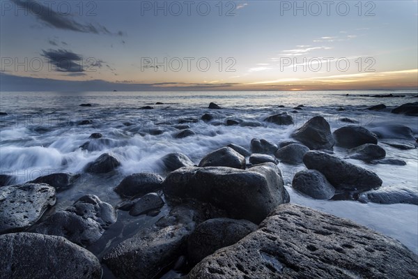 Beach with large rocks in the early morning