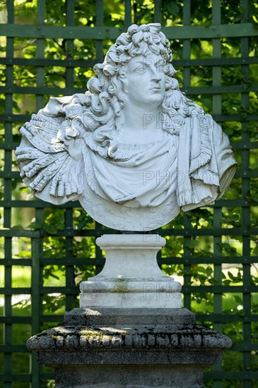 Decorative male bust in the garden archway