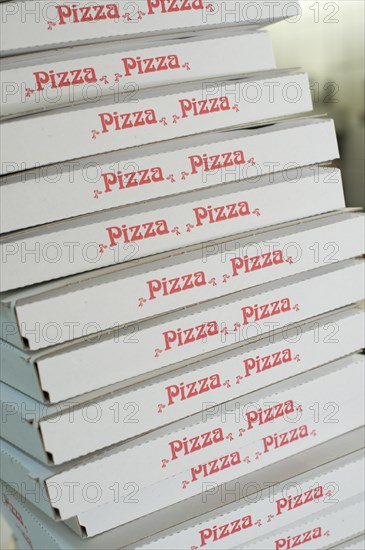 Stacked pizza boxes