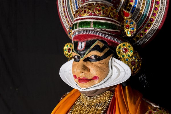 Katakali artist posing dressed up as Shiva