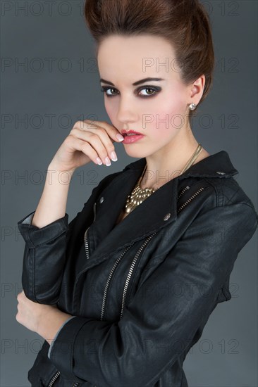 Young woman wearing a leather outfit