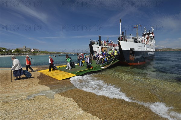 Christian pilgrims walking from the ferry to the pilgrimage island of Iona
