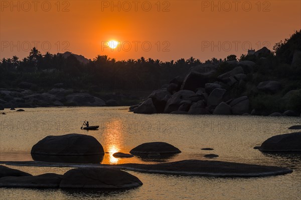 Sunset over Tungabhadra river and a part of the ruins of the former Vijayanagara Empire