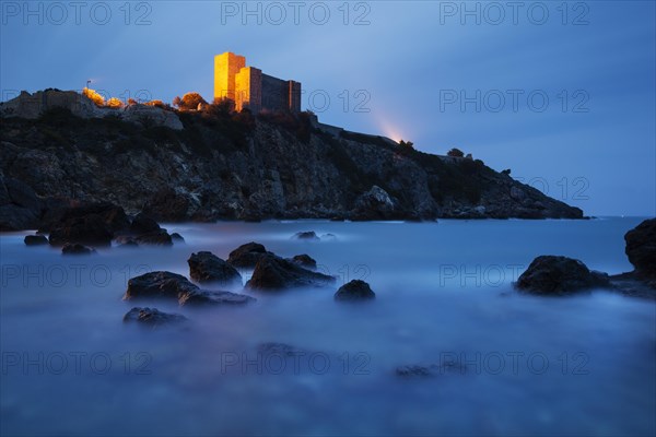 Etruscan castle of Talamone at dusk