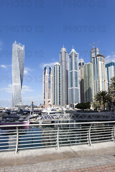Cayan Tower and skyscrapers with marina