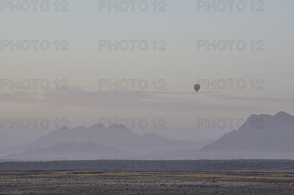 Landscape of the Namib Desert with a hot air balloon