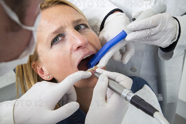 Woman receiving treatment at the dentist