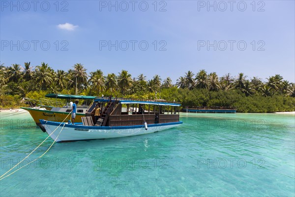 Boat in front of a Maldives island