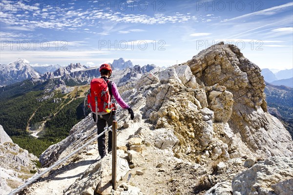 Mountain climber descending from Lagazuoi Mountain in the Fanes Group