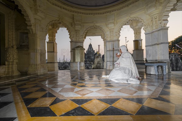 A Jain nun meditating in a temple