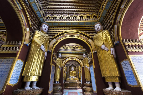 Seated and standing Buddha statues