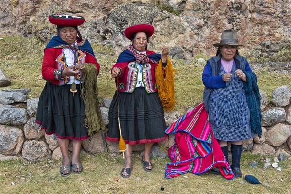 Three elderly women wearing hats