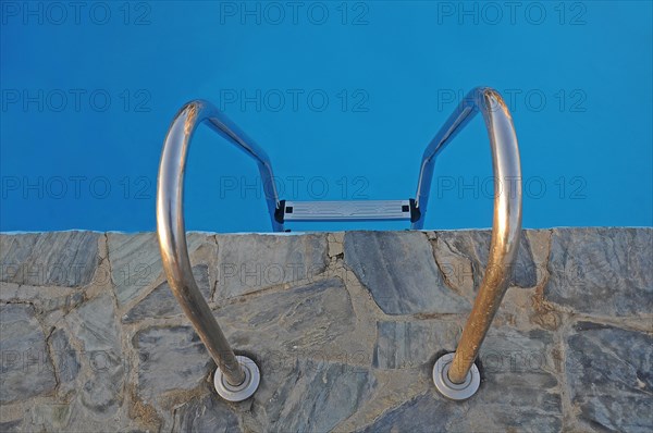 Ladder into a pool