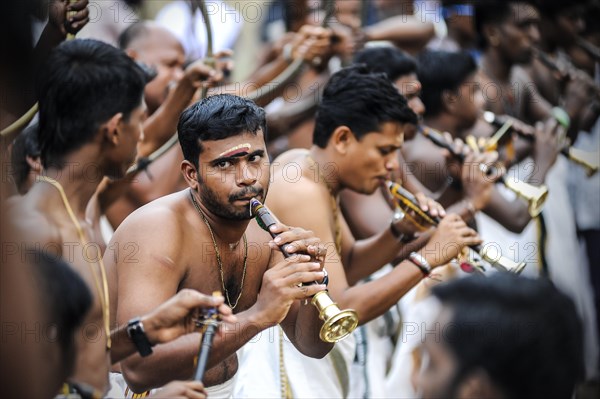 Musicians with trumpets at Hindu temple festival