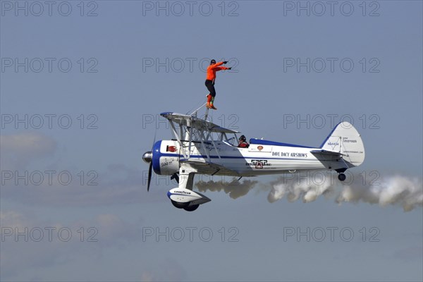 Wing walker on airplane