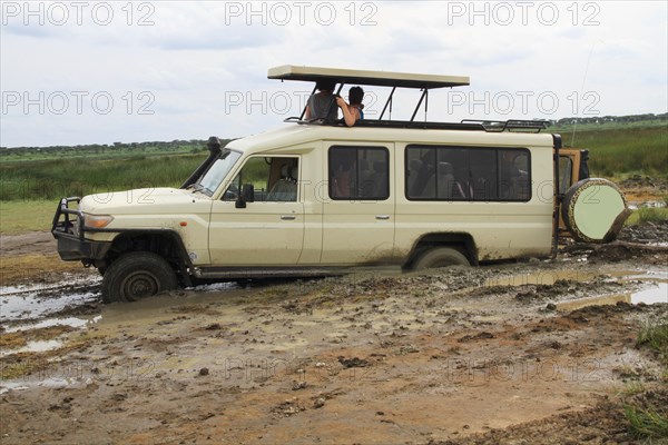 Safari vehicle with tourists