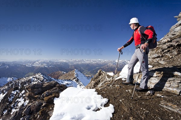 Climber on the summit ridge of the Wilde Kreuzspitze in the Pfunderer mountains