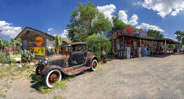 Historic station with an old rusty Ford Model A