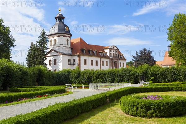 Schlosspark palace gardens with Schloss Christiansburg Palace and the Baroque Cross Church of St. Trinitatis