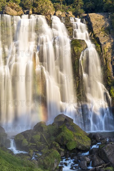 Marokopa Falls in the evening light with a rainbow