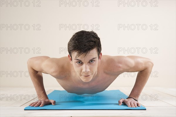 Young man doing pushups