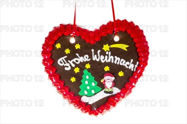 Gingerbread heart with the writing 'Frohe Weihnachten'