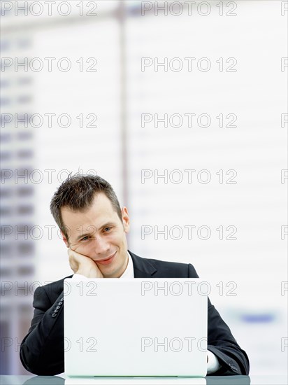 Businessman in an office with a laptop