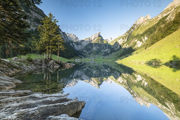 Mountains reflected at sunrise in Lake Seealpsee