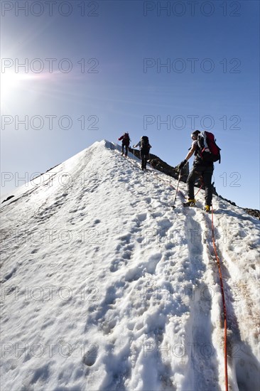 Mountain climbers on the summit ridge of Niederjochferner Mountain