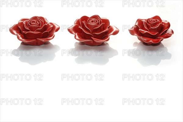 Three rose flowers made of ceramics