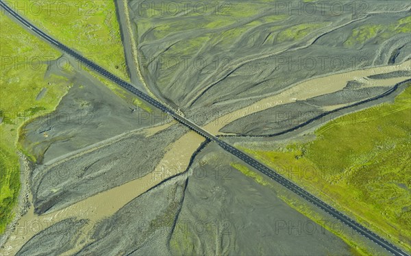 Aerial view of Ring Road No. 1 with a bridge crossing a tributary of the Skaftafellsa glacial river