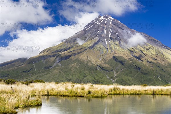 Mountain lake with the Mount Taranaki volcano