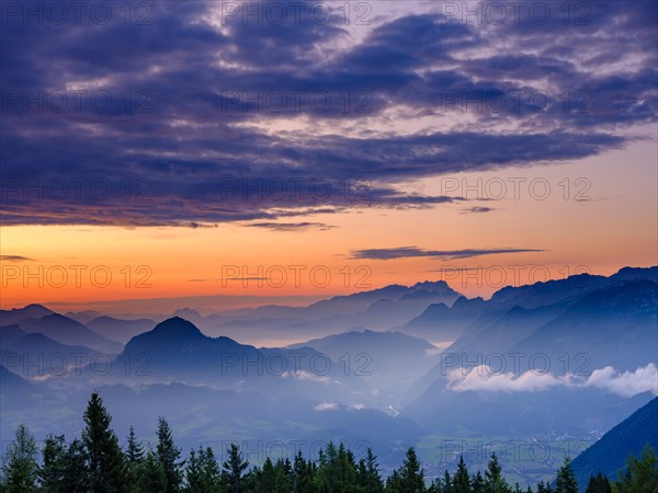 Blue mountain silhouettes at sunrise