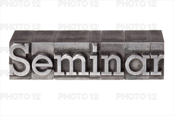 Old lead letters forming the word 'Seminar'