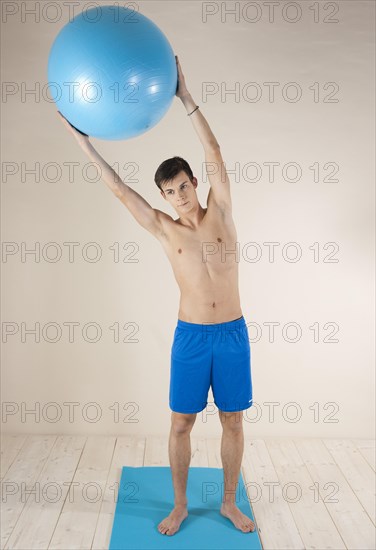 Young man doing stabilization exercises