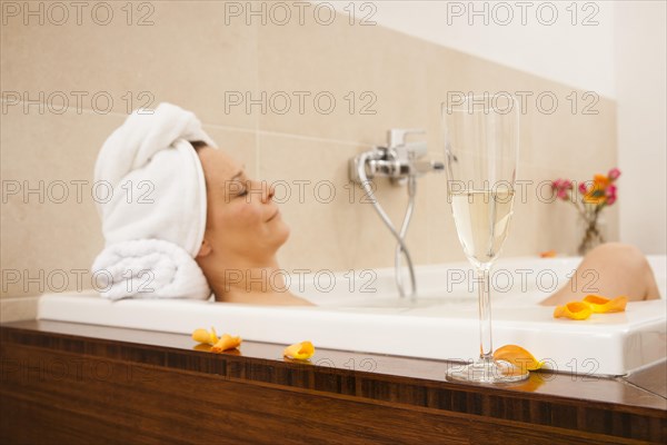 Woman relaxing in a bath