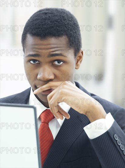 Businessman using a laptop in an office