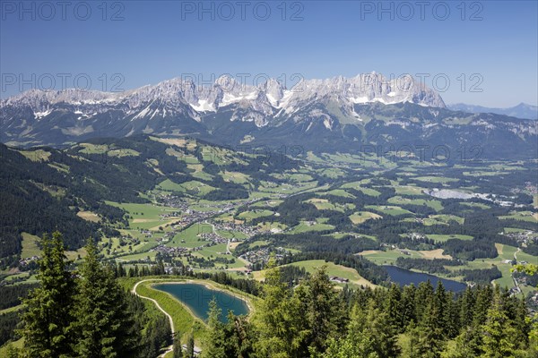 View from the Hahnenkamm summit onto impounding reservoir and Lake Schwarzsee