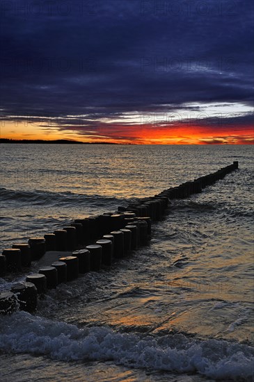 Groynes on a Baltic Sea beach before sunset
