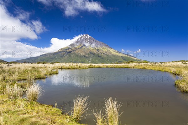 Mountain lake with the Mount Taranaki volcano