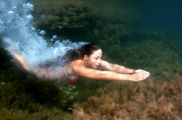 Woman diving into the water