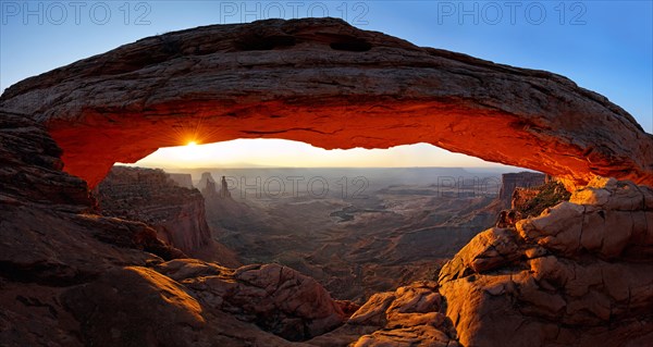 Sunrise at Mesa Arch stone arch