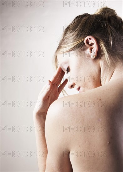 Young woman with a headache