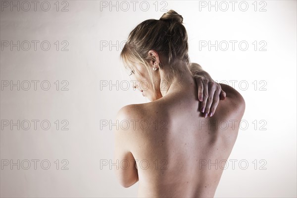 Bare back of a young woman