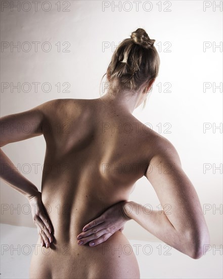 Bare back of a young woman