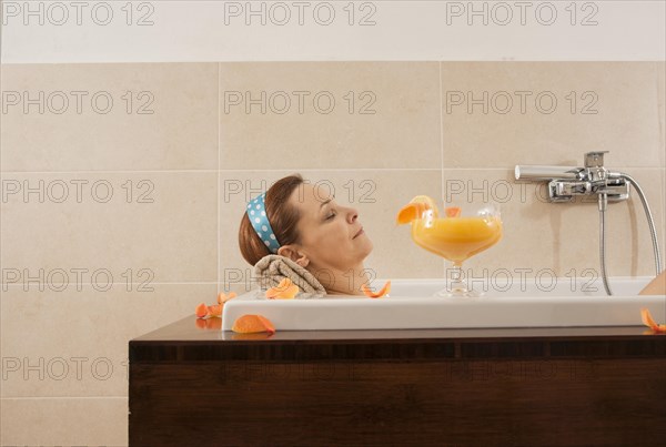 Woman relaxing in a bath