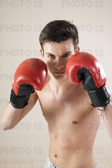 Young man during boxing training