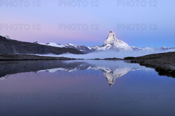 Matterhorn reflected in Lake Stellisee at dusk